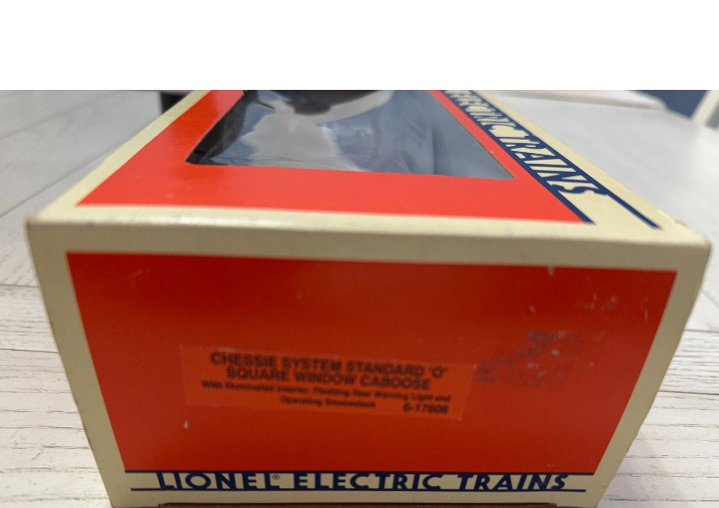 Lionel Electric Trains box on a wooden surface