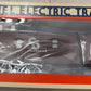 Lionel Electric Trains packaging with a toy train inside on a wooden surface