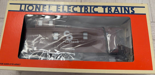 Lionel Electric Trains packaging with a toy train inside on a wooden surface