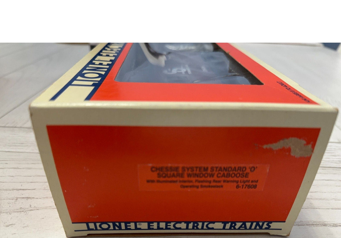 Lionel electric trains box on a wooden surface