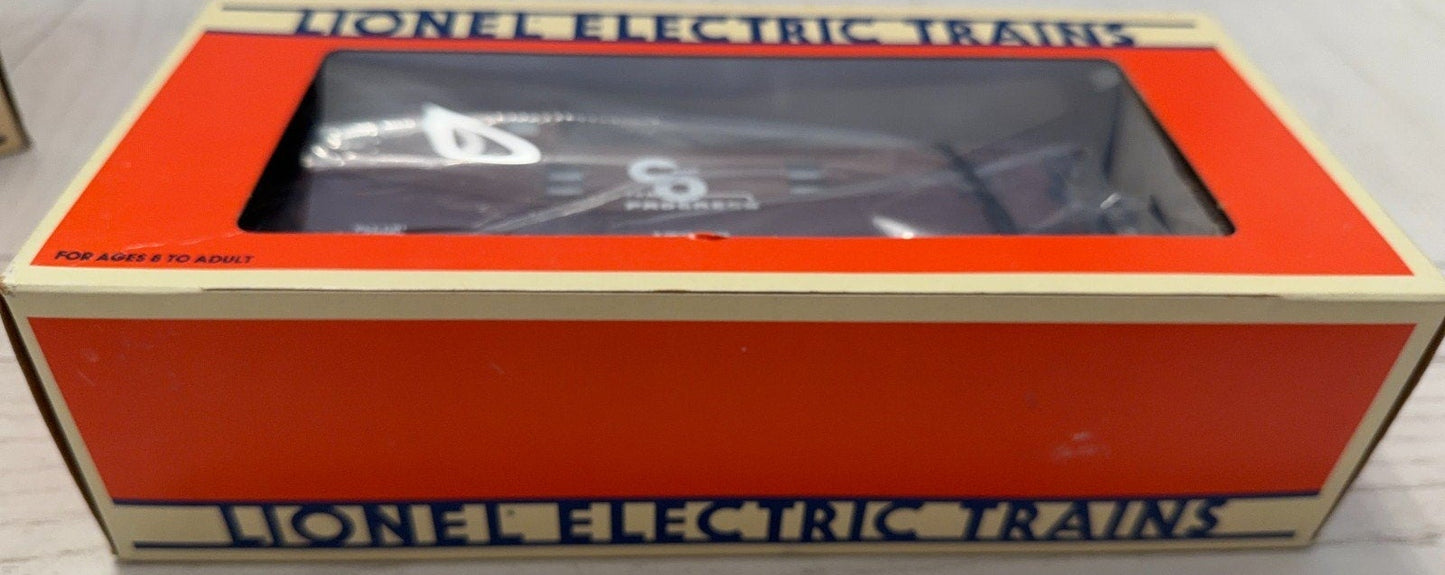 Lionel Electric Trains packaging with a toy train inside on a wooden surface