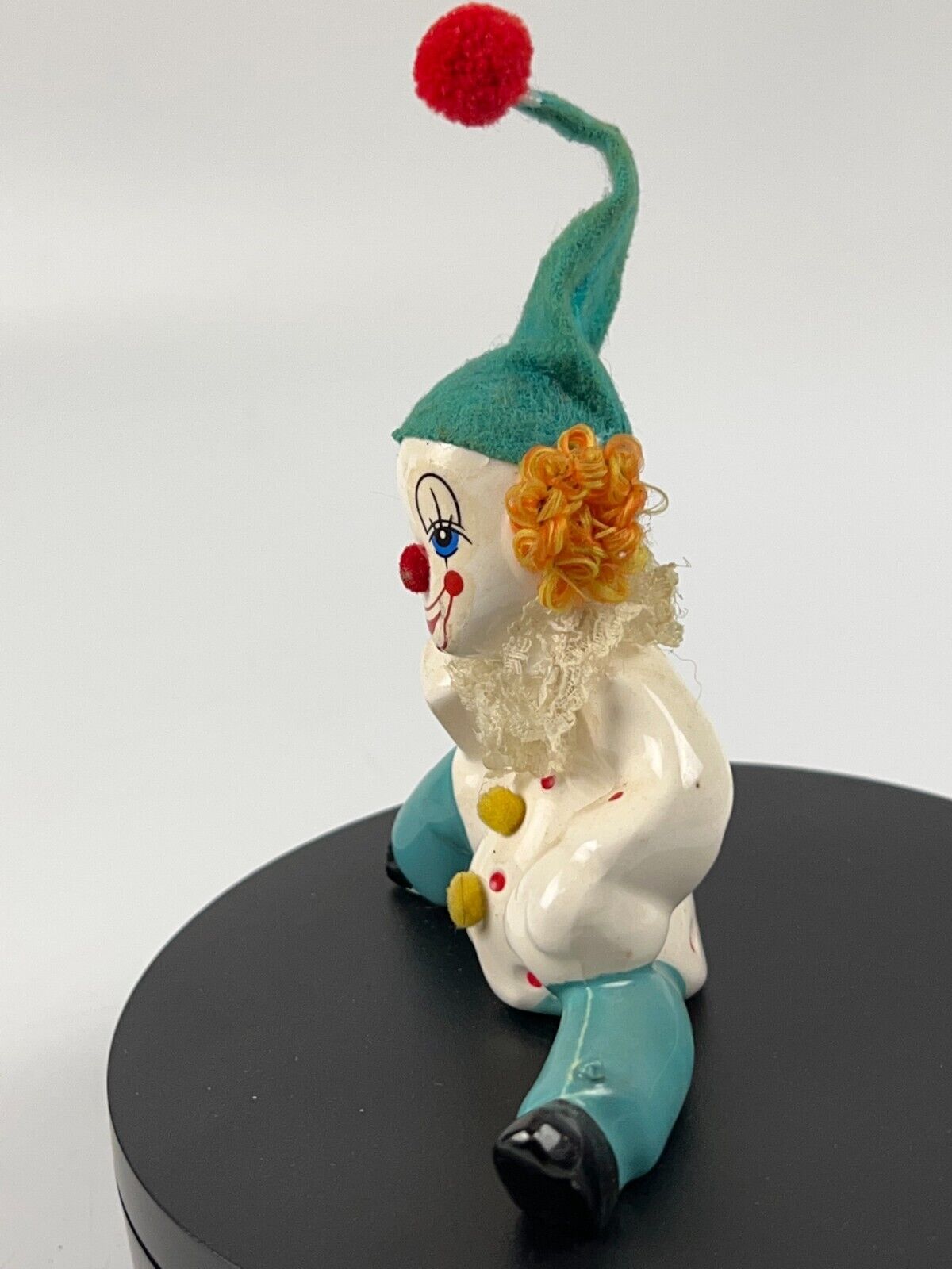 Vintage Miniature Porcelain Clown sitting down with soccer ball and felt hat