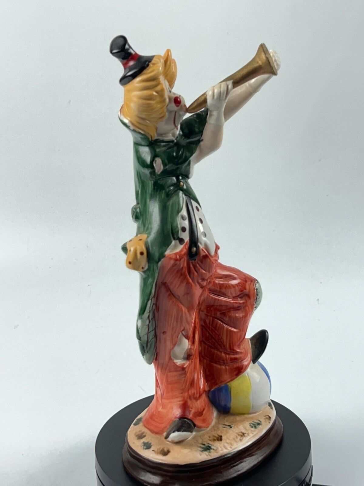 Vintage 11" Clown Blowing a Horn with a Foot on Beach Ball Statue Figurine