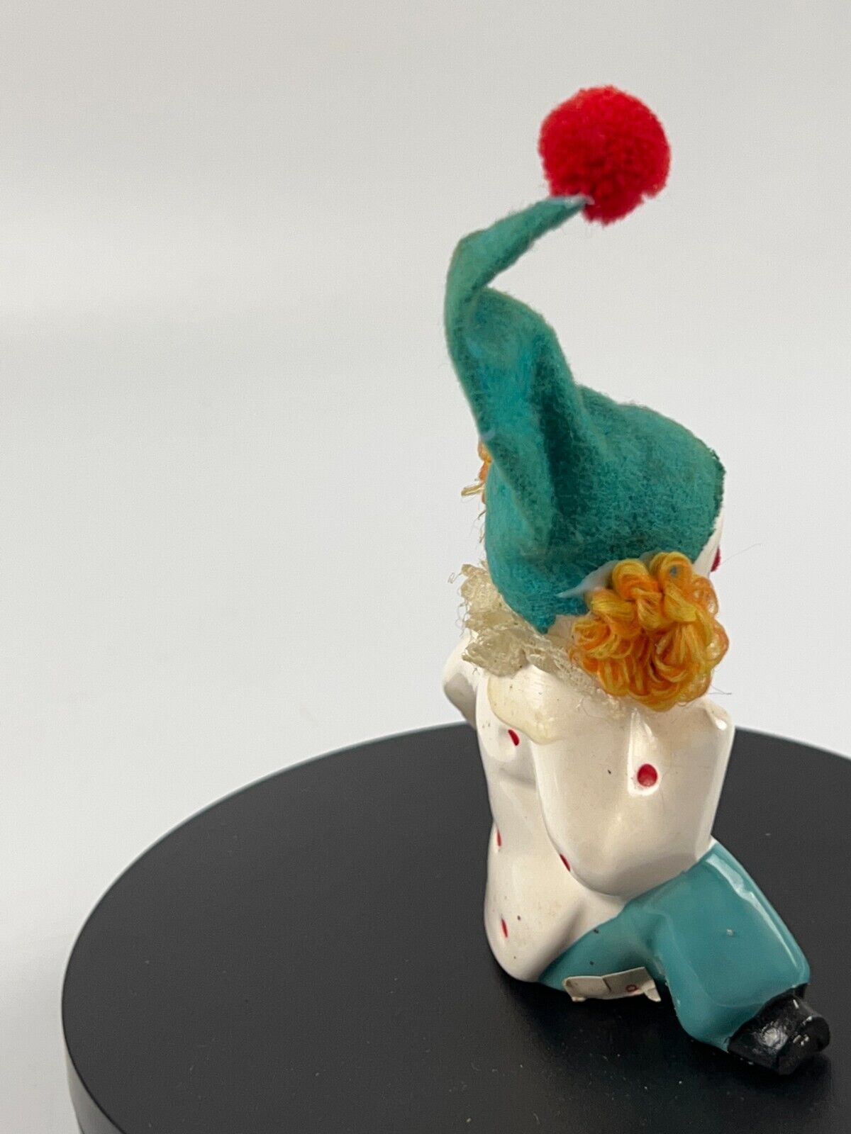 Vintage Miniature Porcelain Clown sitting down with soccer ball and felt hat