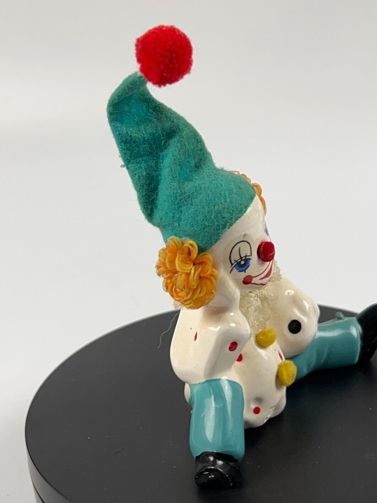 Vintage Miniature Porcelain Clown sitting down with soccer ball and felt hat