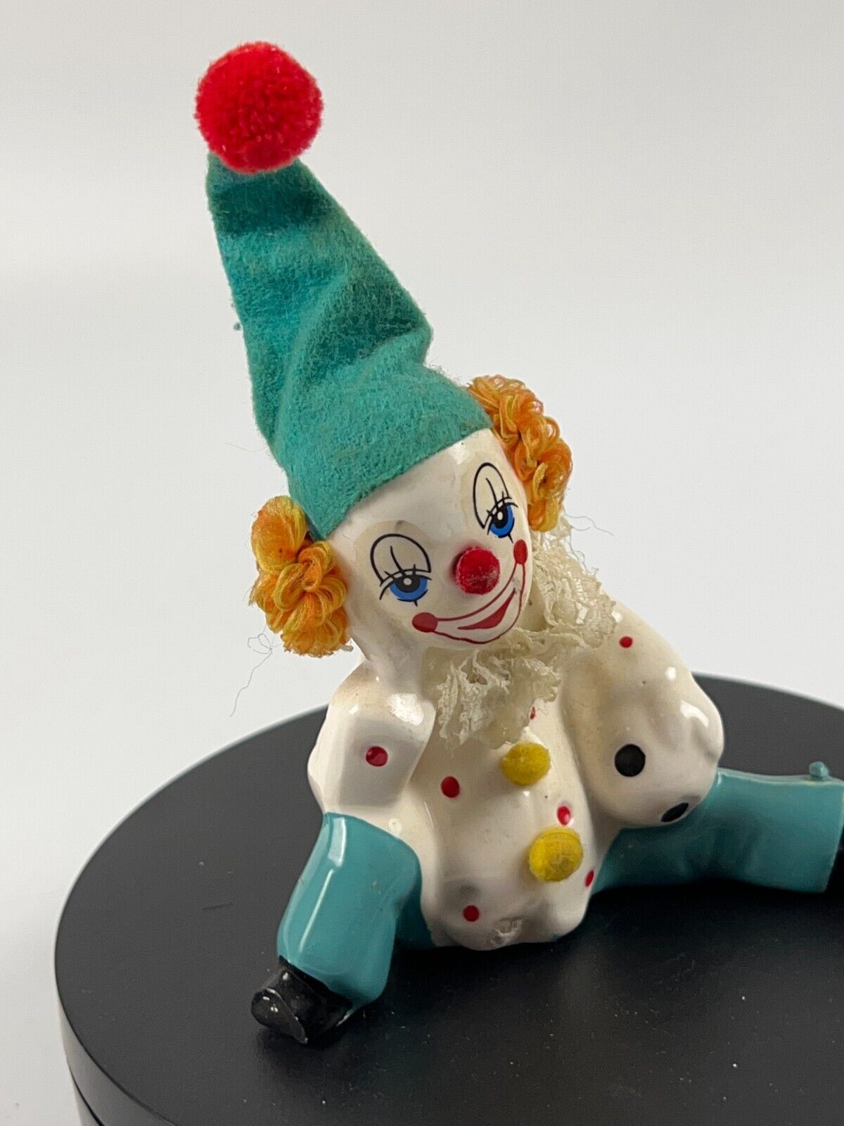 Vintage Miniature Porcelain Clown sitting down with soccer ball and felt hat